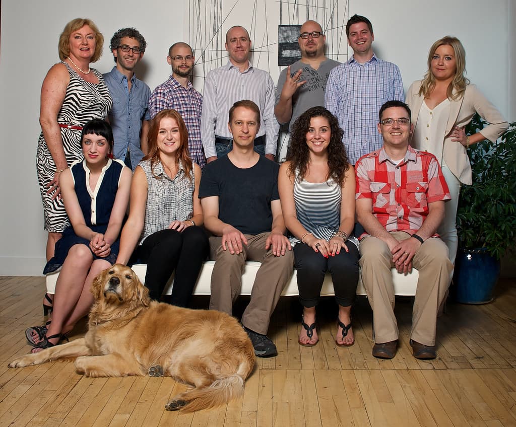 The early BlackSquare team, with a golden retriever lying in front of them