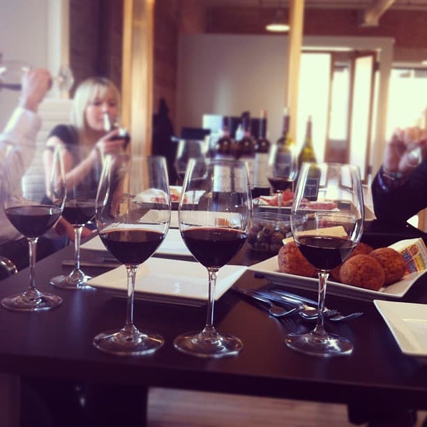 Glasses of red wine on the table at a team tasting in the BlackSquare office
